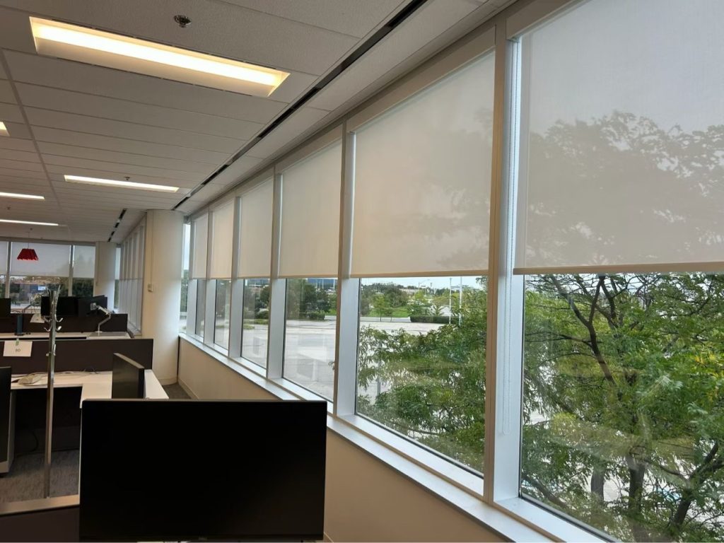 Floor-to-ceiling window wall roller shades for hotel lobby renovation